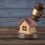 Legal ruling on property fees concept - gavel on house