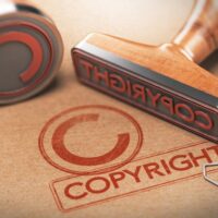 rubber stamps with copyright word and symbol over kraft paper background, Concept of copyrighted material